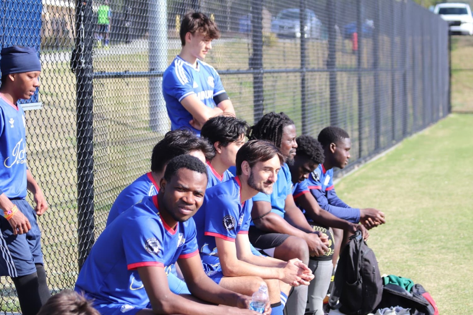 Phantom FC teammates seated together on the sideline